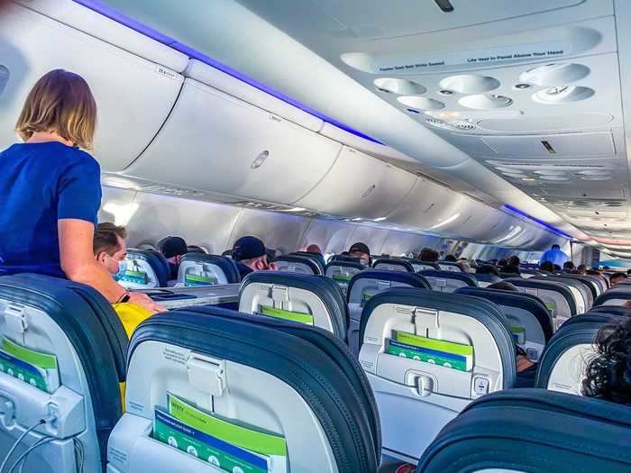 Flight attendants came around shortly after takeoff to start the in-flight snack and drink service.