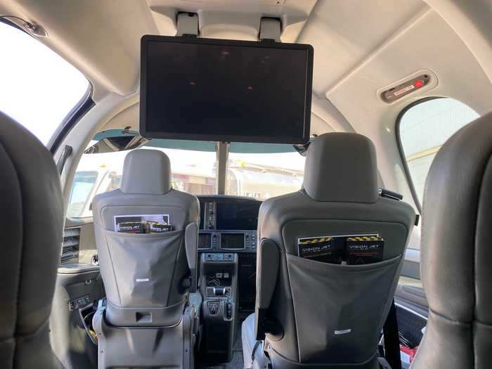 The Vision Jet also has a massive screen that pops down from the ceiling and can be connected to via HDMI. There is low-speed WiFi on the plane but it isn