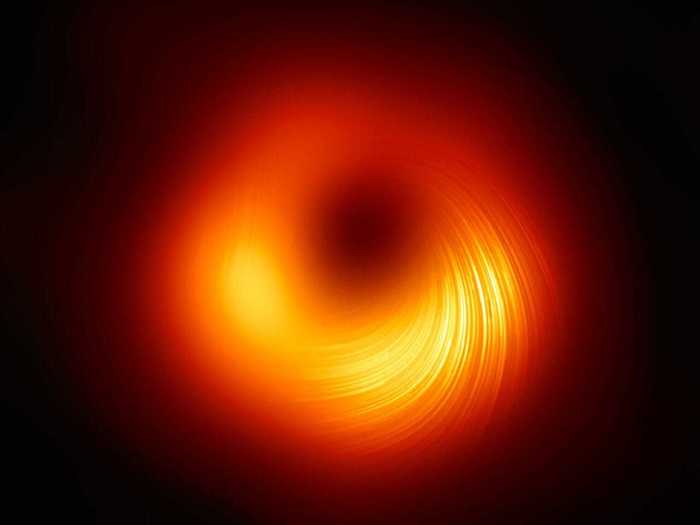 The Event Horizon Telescope revealed the first image of a massive black hole, outlined by rings of light showing the intense gravitational field.