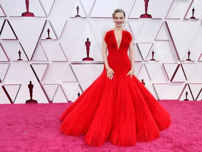 Amanda Seyfried lit up the red carpet in a pleated red dress.