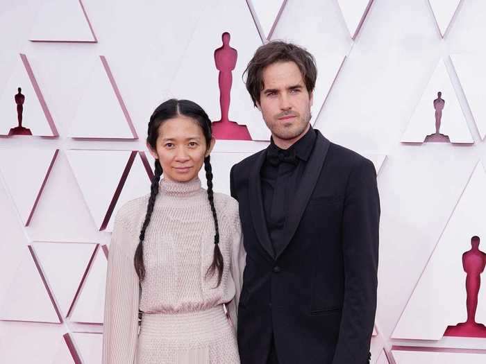 Chloé Zhao and Joshua James Richards attended the Academy Awards in sleek outfits.