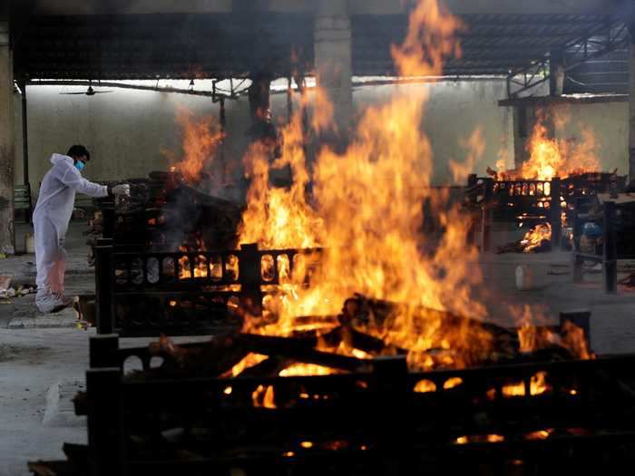 Wooden pyres are used to cremate bodies as part of a traditional funeral rite in India.