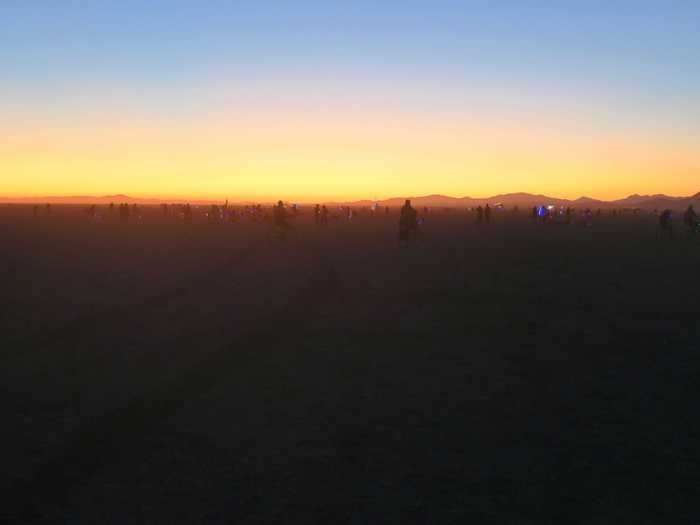  The Black Rock Desert is a dried lake bed with mountains nestled in the distance. 