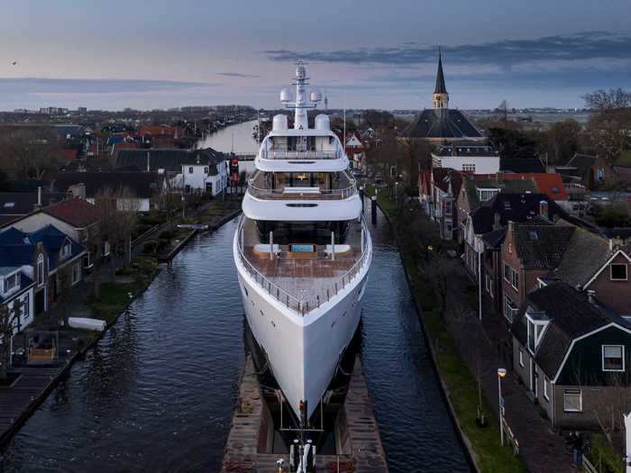 Project 817, a 310-foot superyacht built in the Netherlands, drew crowds earlier this month when the vessel cruised through narrow Dutch canals on its way from a shipyard to the sea, CNN reported.