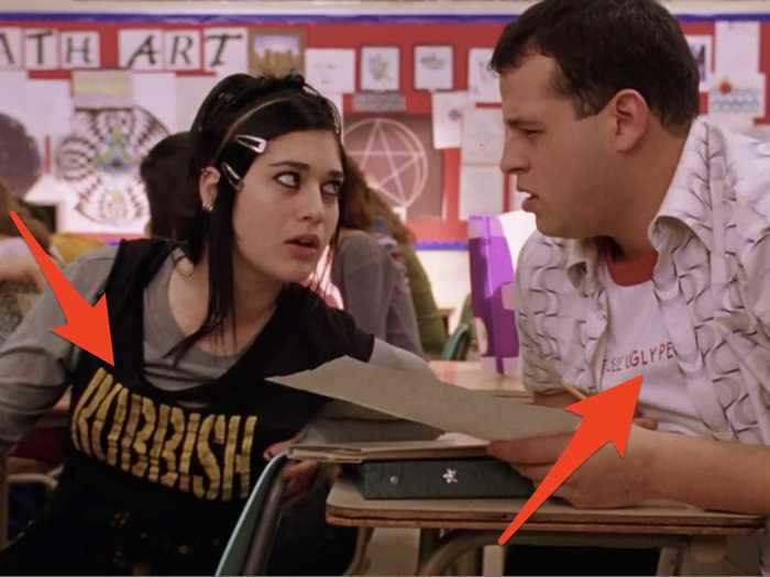 Janis and Damian both wore statement T-shirts in their first scene.