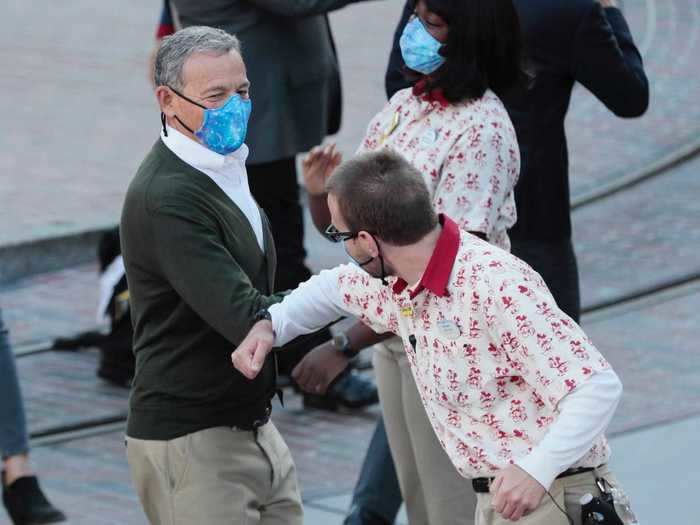 Former Disney CEO Bob Iger made an appearance, bumping elbows with a Disneyland employee.