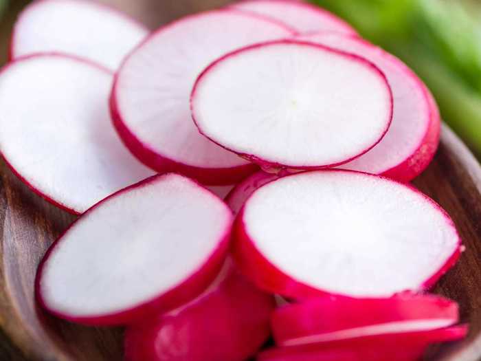 Radish slices add texture and freshness to guacamole.