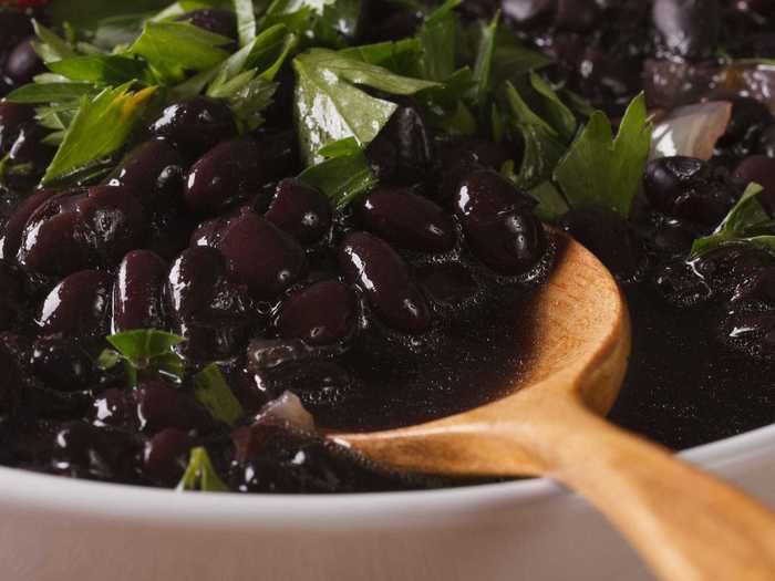 Black beans add extra savory flavor and protein to guacamole.