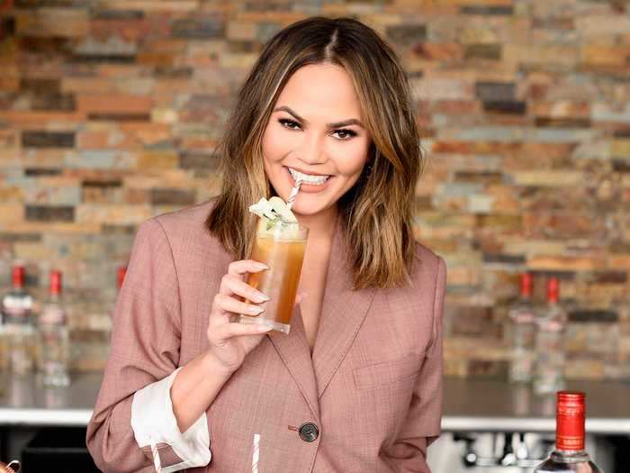 Chrissy Teigen prefers her margaritas to have a little kick - she recommends adding jalapeños and spice to the rim.