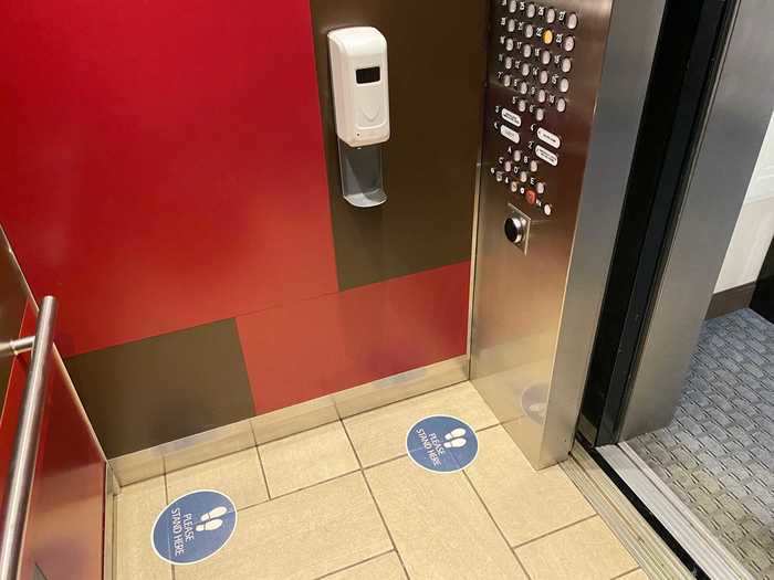 More floor placards guided the way to the elevators, complete with its own hand sanitizer dispenser...