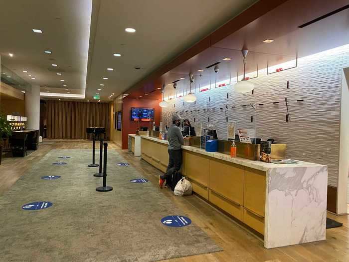 Social distancing placards then lined the floor leading up to the check-in desk, which was fitted with plexiglass partitions. I was glad I could skip all of this.