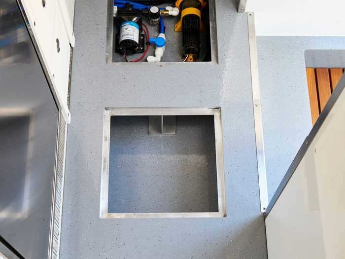 One of the units is used to store the plumbing systems, but the other two are empty, creating discrete storage space.