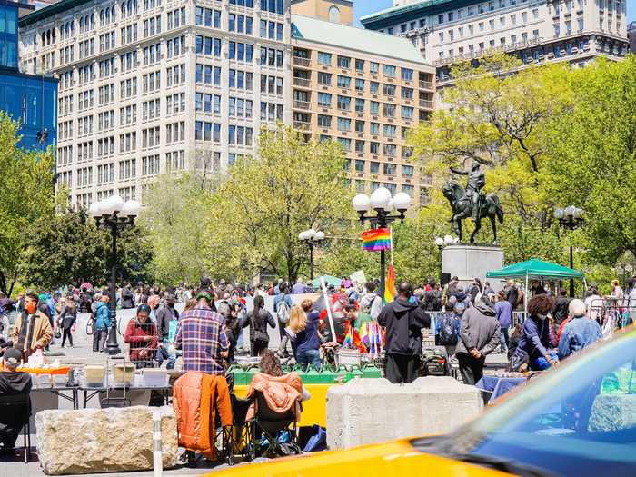 On May 1, the park was filled with people demonstrating, shopping, and relaxing.