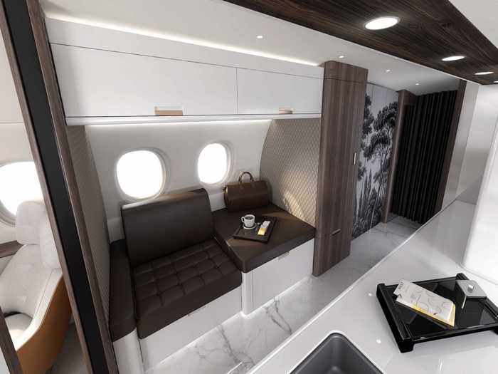 Even the galley kitchen is used as a living area, with the crew rest area doubling as a seat. Unlike other private jets, two windows illuminate the kitchen with natural light and open the space that