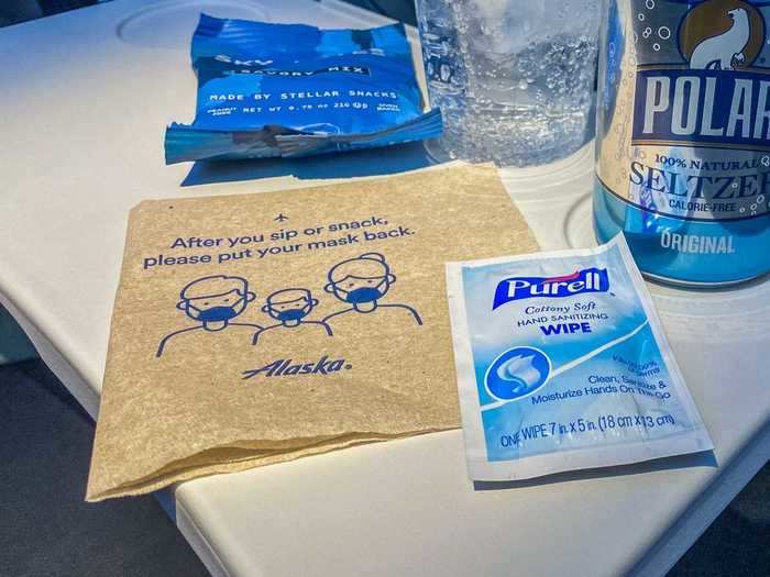 Flight attendants also distributed Purell wipes, and a reminder to wear a mask in between bites and sips was also printed on the napkin.