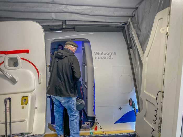 Flight attendants welcomed passengers onboard the aircraft but didn