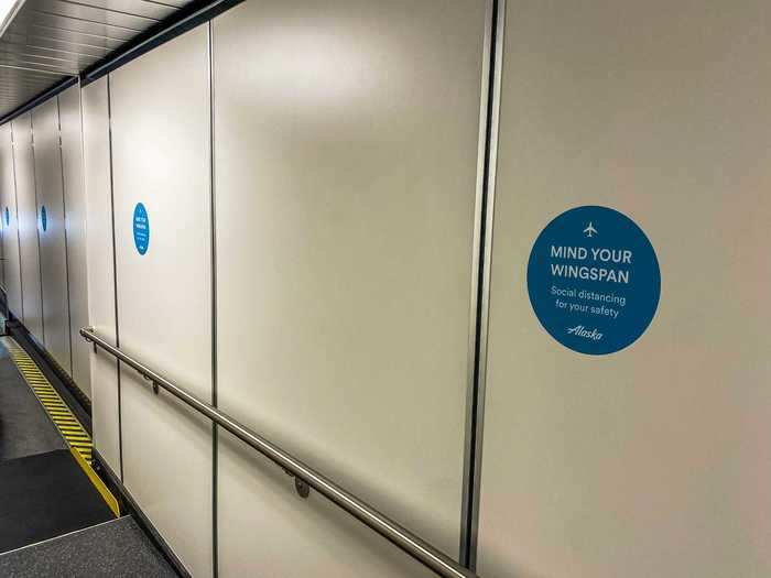 So far, I was impressed. Boarding then began and Alaska placards lined the jetway reminding passengers to social distance as they wait.