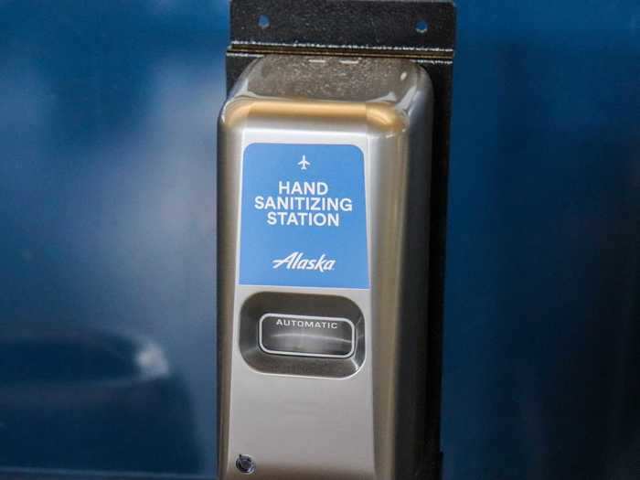 Hand sanitizer stations were scattered throughout the terminal and placed next to check-in kiosks.