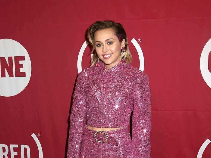 Months later, Cyrus hit the red carpet in a sparkling suit and cowboy boots.