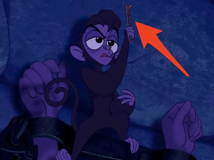 Abu uses a bobby pin to free Aladdin.