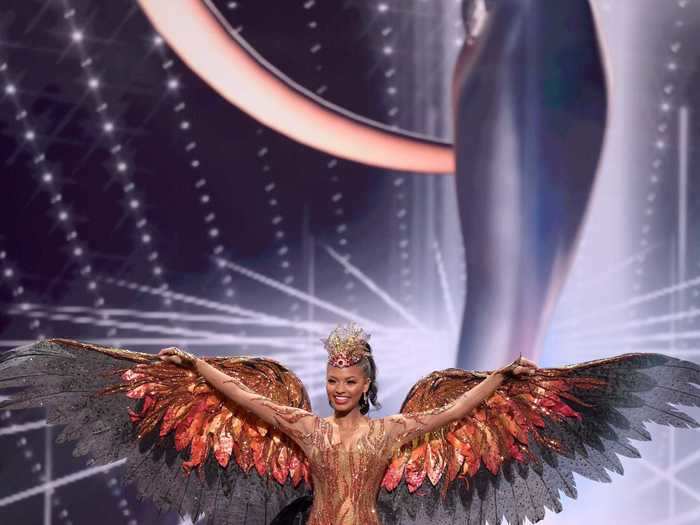 Asya Branch, Miss USA, sparkled in red, orange, and black wings that paid homage to the mockingbird, Mississippi