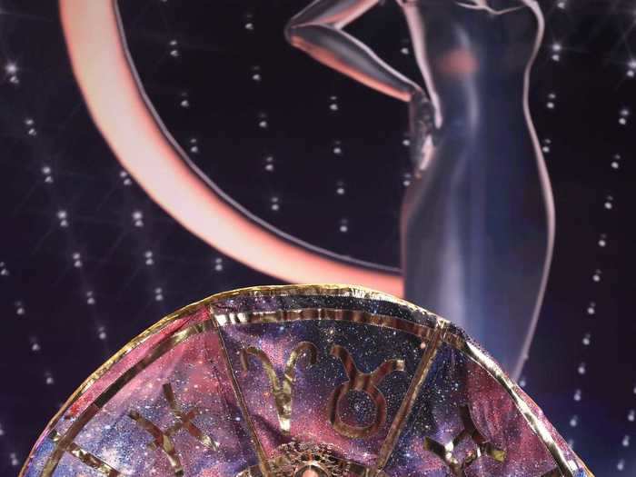 Estefanía Natalia Soto Torres, Miss Puerto Rico, channeled the zodiac signs with her national costume, which featured a metallic purple gown, gold cape, and sparkling tights.