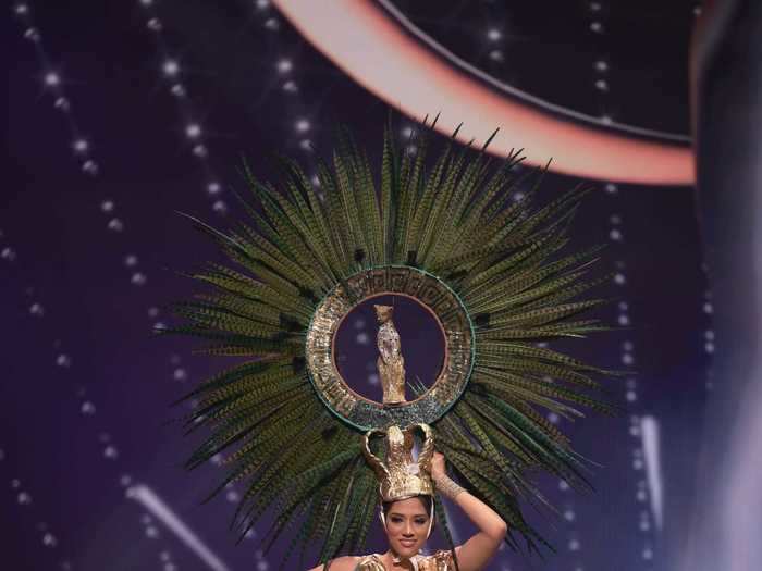 Miss Honduras, Cecilia Rossell, wore a shimmering gold two-piece with a dramatic feather headdress that paid tribute to the Jaguar Moon Goddess from ancient Mayan culture.