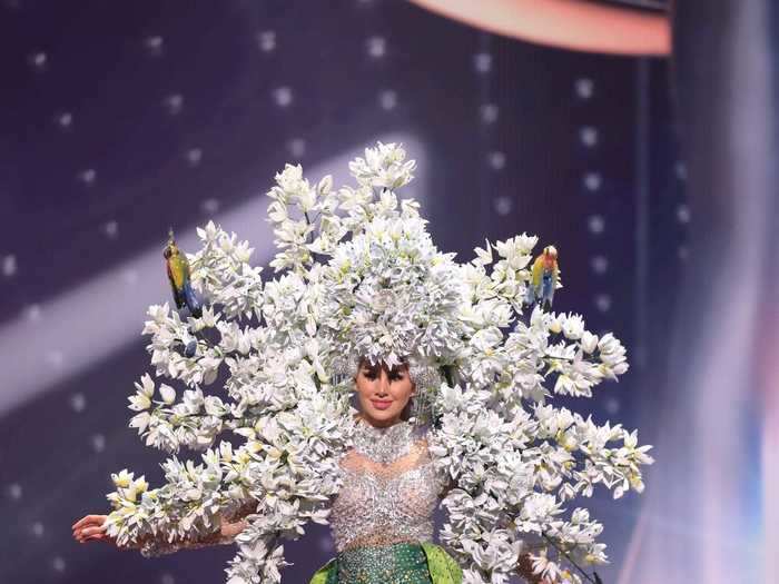 Miss El Salvador, Vanessa Velásquez, wore a floral-inspired outfit with a bedazzled top, tights, and massive flower headpiece.