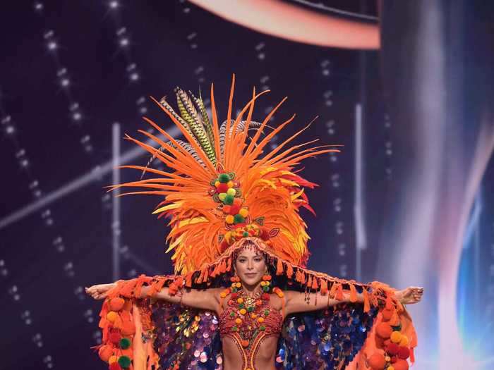 Miss Colombia, Laura Olascuaga, paired a textured orange bodice with an intricate purple-and-orange cape.