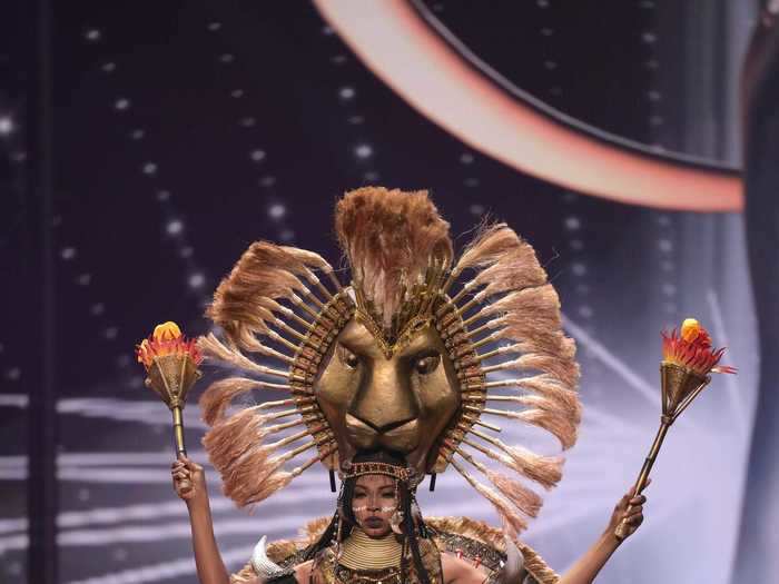 Miss Cameroon, Kossinda Angele, wore a two-piece with an elaborate cape and headpiece, both of which were adorned with lion faces.