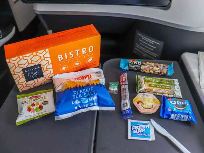 The bistro snack box that included the traditional meat, cheese, and cracker assortment that is standard on all airlines. It also includes some other goodies including Oreo cookies, gummy bears, Tic Tacs, a Kind bar, and potato chips.