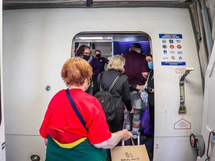 Flight attendants were extremely diligent at the boarding door, reminding passengers to wear their masks and offering new ones to those who didn