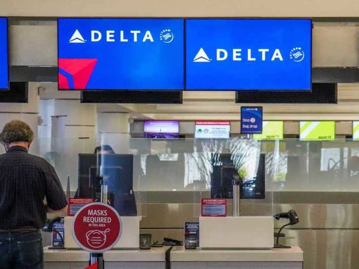 Mask reminder signage was placed on stanchions along the check-in line.