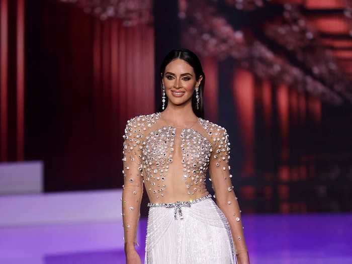 Miss Puerto Rico opted for a sheer top covered in crystals and a white fringe skirt for her evening look.