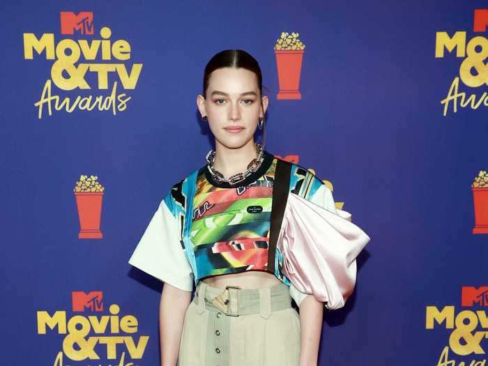 Victoria Pedretti wore oversized pants and an asymmetrical top for her red-carpet look.