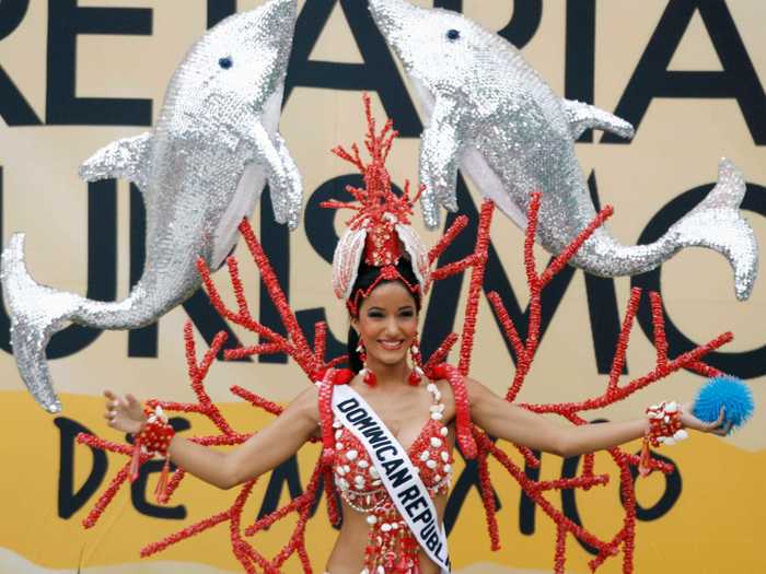 Miss Dominican Republic 2007, Massiel Taveras, shouldered two massive dolphins and a coral headpiece.