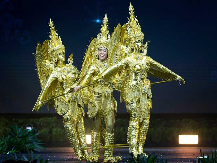 Miss Universe Laos 2018, On-anong Homsombath, carried two additional figures with her.