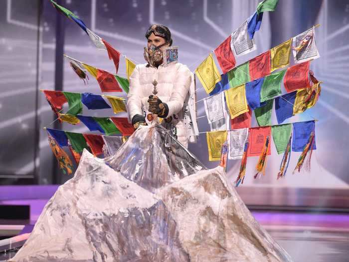 Anshika Sharma, Miss Nepal 2020, walked the runway with a cutout of Mount Everest and traditional Nepalese prayer flags.