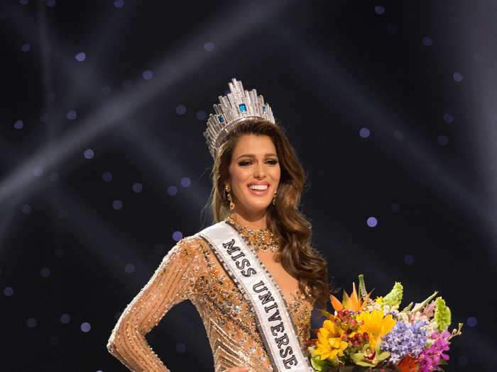 Iris Mittenaere of France was crowned in 2017 while wearing a form-fitting gold gown.