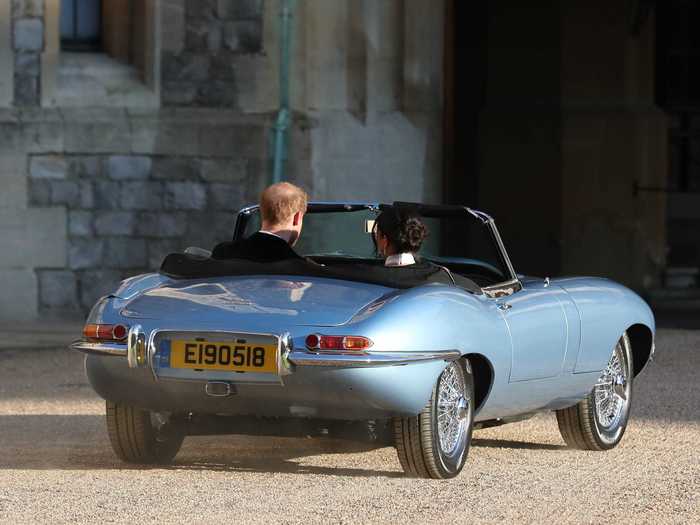 They traveled to their evening reception in a car with a personalized registration plate.