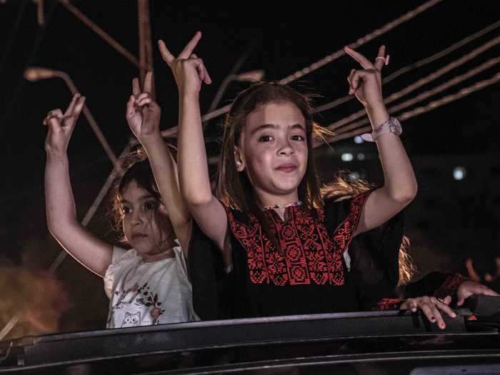 Palestinians in Gaza poured into the streets to celebrate the Israel-Hamas ceasefire.