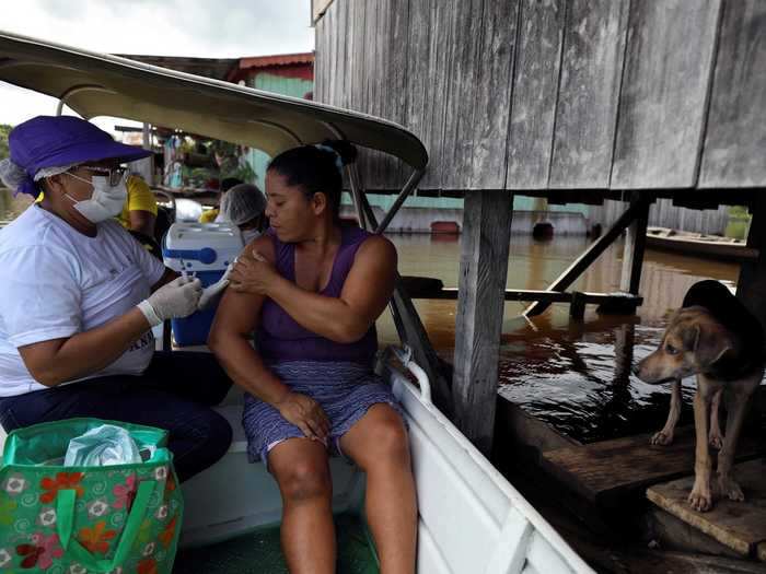 Health officials in Brazil are hoping to target more remote communities by offering the vaccine in little river boats.