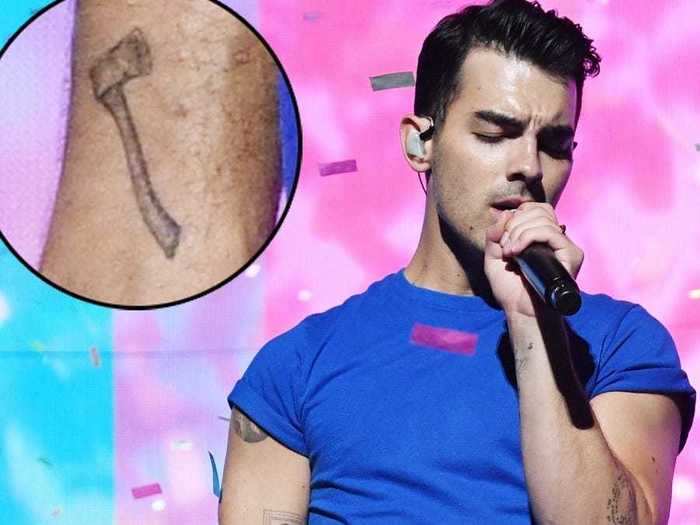 Joe got a small axe tattoo on his right wrist in April 2018.