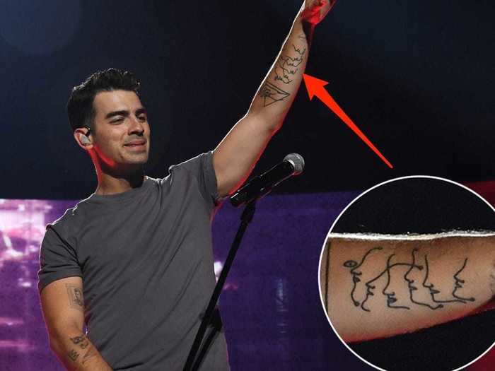 Sometime in early 2018, Joe got an abstract tattoo of six faces along his left arm.