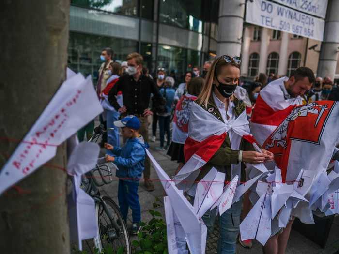 Protestors used paper airplanes as a visual prop to symbolize the aircraft being diverted to Minsk.