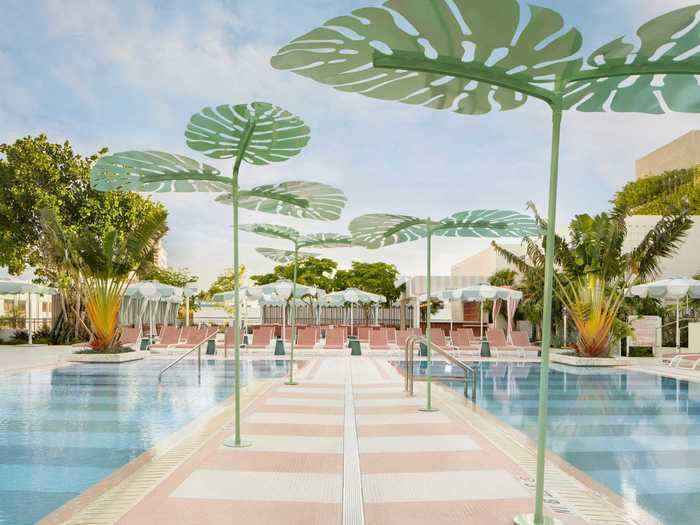 The centerpiece of the hotel is Strawberry Moon, a 30,000-square-foot pool area with pastel-pink tiled walkways and larger-than-life palm-leaf sculptures.