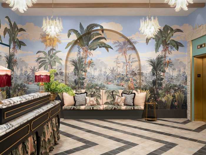 Past the entranceway is the lobby, which feels like a step back in time with its hand-painted murals, Art Deco-era plasterwork, and fringed lamps.