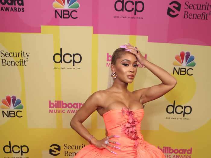 Saweetie stole the show in this coral ballgown at the Billboard Music Awards.