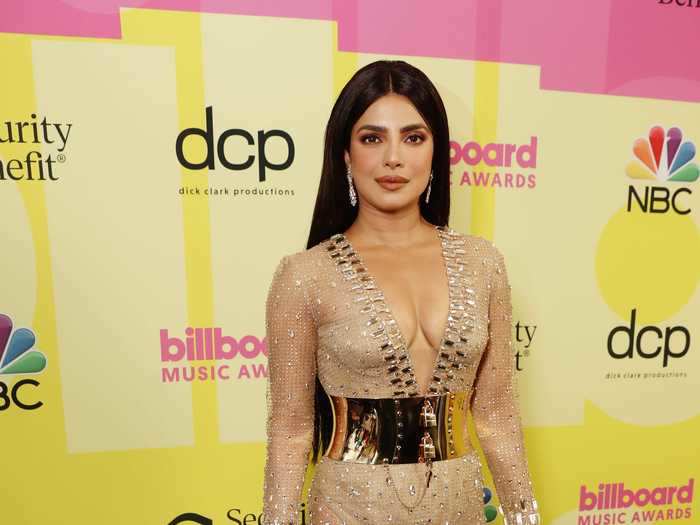 Priyanka Chopra stunned in a sheer gown with a metallic corset-like belt at the Billboard Music Awards.