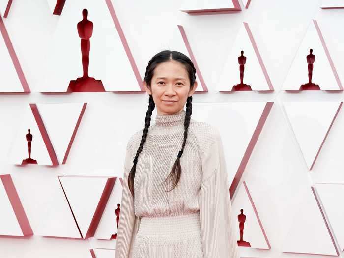 Chloé Zhao cemented her legend status by pairing a nude designer gown with white sneakers at the Oscars.